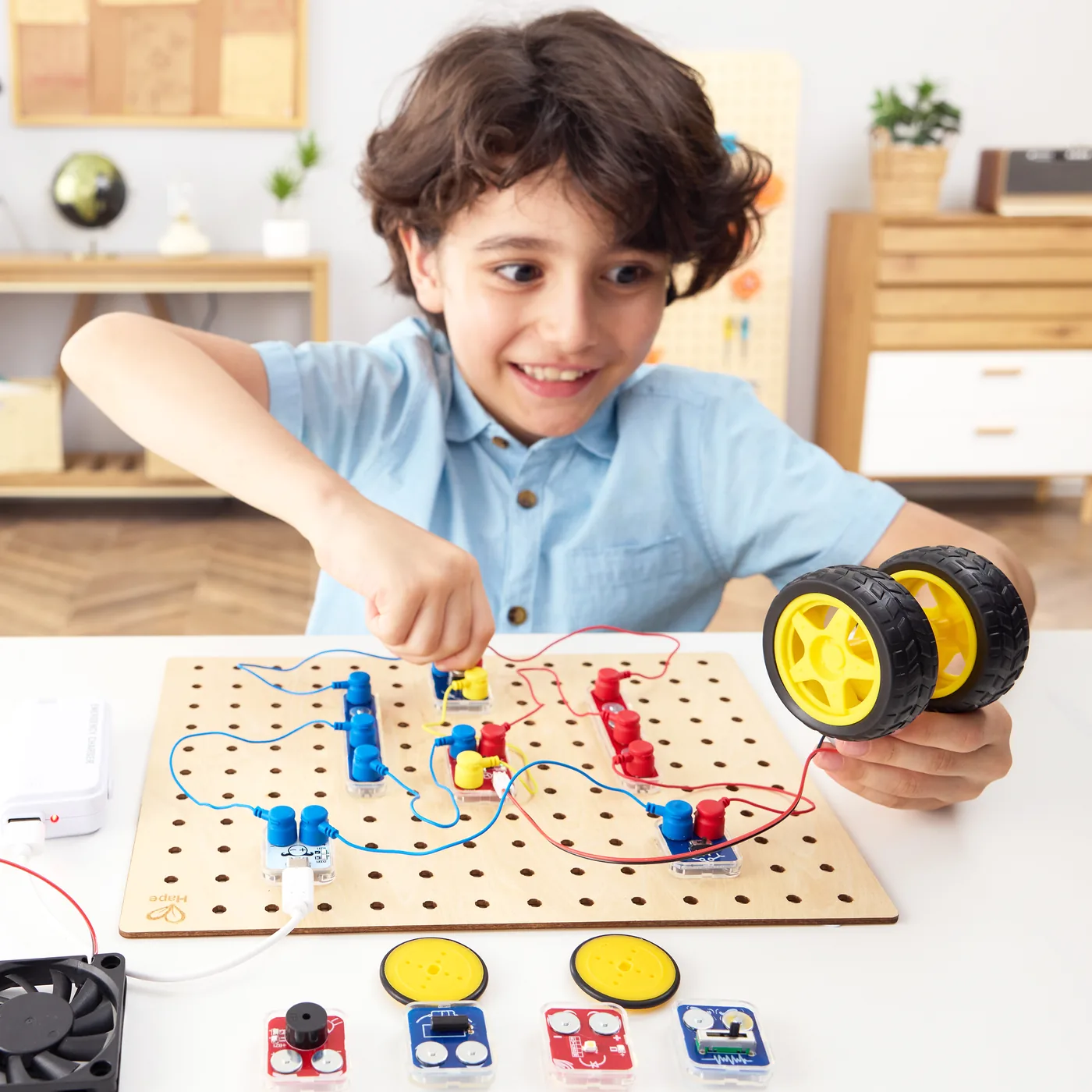 A child building with the Circuit Explorer Base set