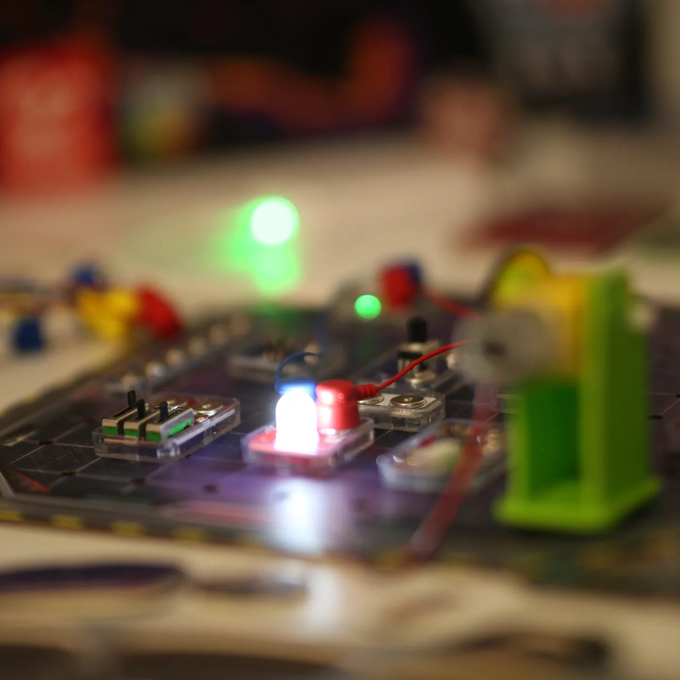 The Reactor Rescue board at night, circuit LEDs lit